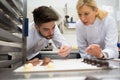 Workers wiyj production line baking chocolate Royalty Free Stock Photo