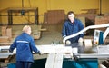 Workers at wood processing with circ saw Royalty Free Stock Photo