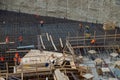 Workers at work for the construction of the reinforced concrete base