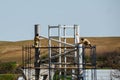 Workers work at a construction site while on scaffolding.Metal construction Royalty Free Stock Photo