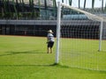 Workers work in the football field