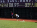 Workers work in the football field