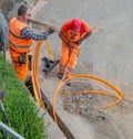 Workers at work to bury the cables of the ultra-fast network