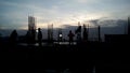 Workers working in the evening time for a building construction, silhouette image.