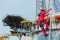 Workers working on high ground wearing equipment full safety harness