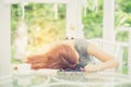 Workhard young asian woman tried and sleep on desk in the garden Royalty Free Stock Photo