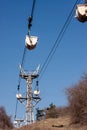 Working Aerial Cable Railway on the Background of Blue Sky