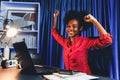 Working African woman with happy glowing and smiling face. Tastemaker. Royalty Free Stock Photo