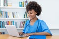 Working afro american nurse or medical student at computer Royalty Free Stock Photo