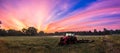 Working agicultural machinery on a sunny spring day - sunset or sunrise Royalty Free Stock Photo