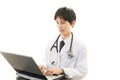 Working Asian doctor Royalty Free Stock Photo