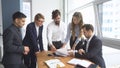 Working atmosphere in the office. employees to view documents in the workplace. group of business people discussing Royalty Free Stock Photo