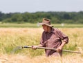 Working in barley field Royalty Free Stock Photo