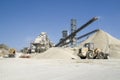 Working belt conveyors and a piles of rubble in Gravel Quarry Royalty Free Stock Photo