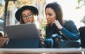 Working business process concept. Freelancer communicate on startup project in cafe outdoor, girls using digital tablet. Friends Royalty Free Stock Photo