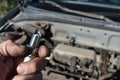 Working on Car Changing Spark Plugs Under the Hood