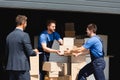 Working with carton boxes in warehouse Royalty Free Stock Photo