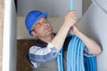 he working on ceiling pipes Royalty Free Stock Photo