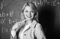 Working conditions which prospective teachers must consider. Woman smiling educator classroom chalkboard background