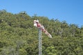 Working construction crane landscape with green trees and blue sky background. Gosford, Australia Royalty Free Stock Photo