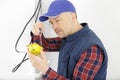 working contractor electrician fixing cable Royalty Free Stock Photo