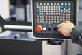 Working with control panel of CNC machining center Royalty Free Stock Photo