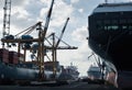Massive Container Ships and Cranes at Busy Port Loading and Unloading Cargo Royalty Free Stock Photo