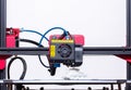 Working 3d printer. Printhead with hotend and fan close-up. Isolated on white background. Royalty Free Stock Photo