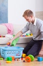 Working daddy cleaning home Royalty Free Stock Photo