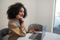 Dark-haired cute business woman at the laptop in the office