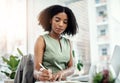 Working diligently. an attractive young businesswoman writing in her diary while working in the office. Royalty Free Stock Photo