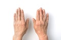 Working dirty hand of an elderly man close - up on a white background.