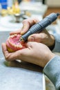 Working with a drill in a dental prosthesis