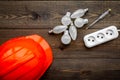 Working with electrical equipment. Hard hat, socket outlet, bulbs, screwdriver on dark wooden background top view copy Royalty Free Stock Photo