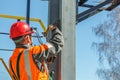 Working electrician hooks a safety rope Royalty Free Stock Photo