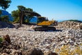 Working excavator building a house on the Lycian Trail in Turkey.