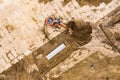 Working excavator on construction site. producing earthworks. top view aerial photo Royalty Free Stock Photo