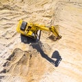 Working excavator in the mine.