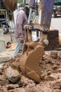 Working Excavator Tractor Digging road. Royalty Free Stock Photo