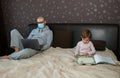 Working father and his daughter in a home quarantine