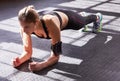 Working for flatter abs and a stronger core. a woman doing bodyweight exercises at the gym.