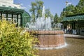 Working fountain in a small town square. The fountain decorates the urban space Royalty Free Stock Photo