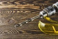 Working goggles and electric drill on the workbench Royalty Free Stock Photo