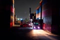 Working at the harbor at night, the container carrier is loading the trucks into the truck