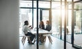 Working hard on their winning ideas and strategies. a group of businesspeople having a boardroom meeting in an office. Royalty Free Stock Photo