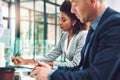 Working hard to become the game changers. two corporate businesspeople working together in an office. Royalty Free Stock Photo