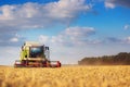 Working Harvesting Combine in the Field of Wheat Royalty Free Stock Photo