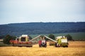 Working Harvesting Combine in the Wheat field Royalty Free Stock Photo