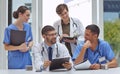 Working on healthcare matters with utmost dedication. a group of medical practitioners working together in a hospital Royalty Free Stock Photo