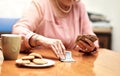 working on her card game. an unrecognizable senior woman in playing cards in an old age home. Royalty Free Stock Photo